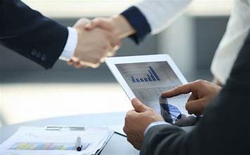 Close-up of a handshake symbolizing strategic partnerships in energy financing.